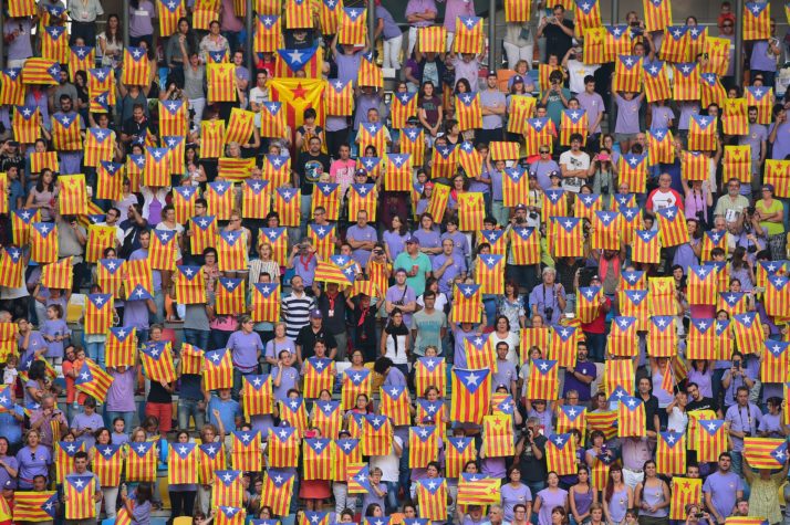 People show pro-independence flags during a human tower competition in Tarragona | Lluís Gené, AFP via Getty Images